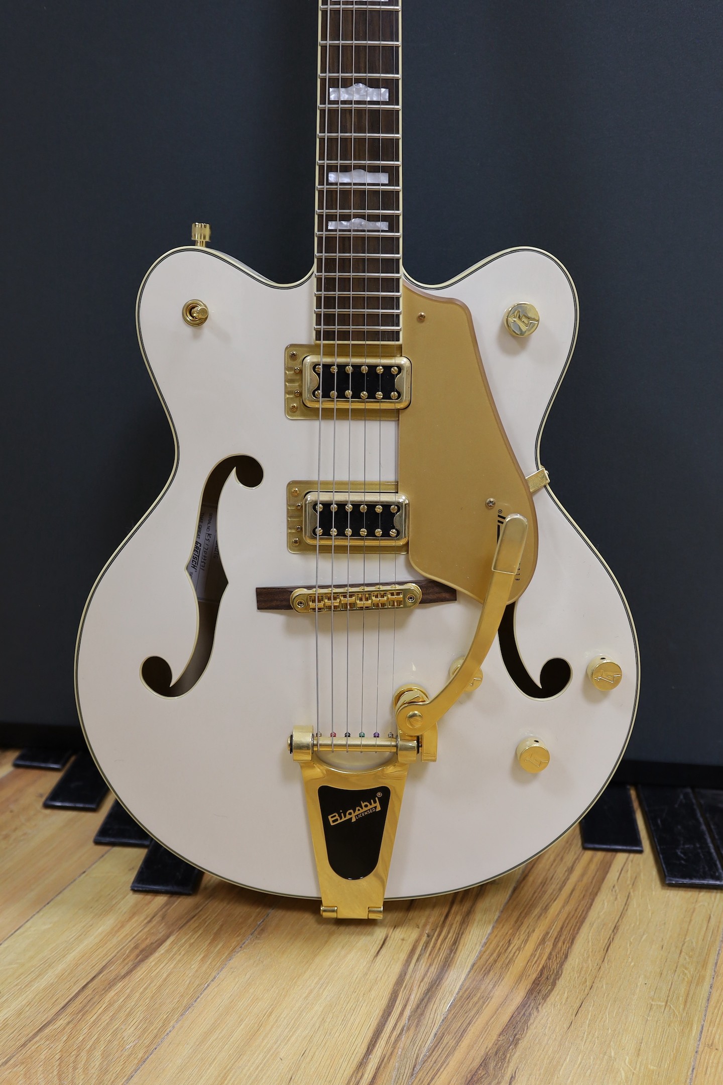 A Gretsch Bigsby electromatic guitar with case